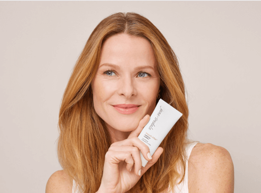 Woman with Jane Iredale product