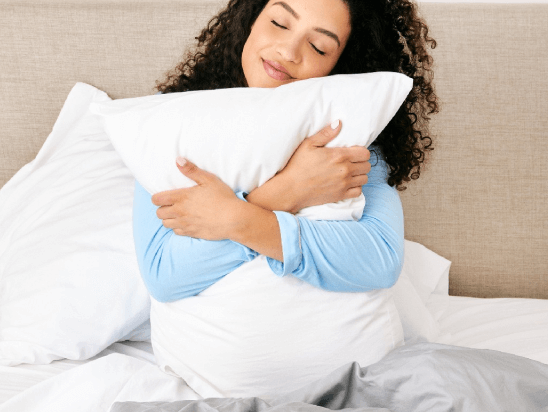 Woman Hugging Slumber Cloud Pillow